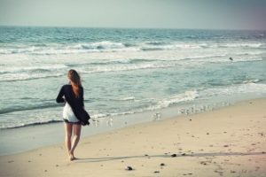 woman walking on beach